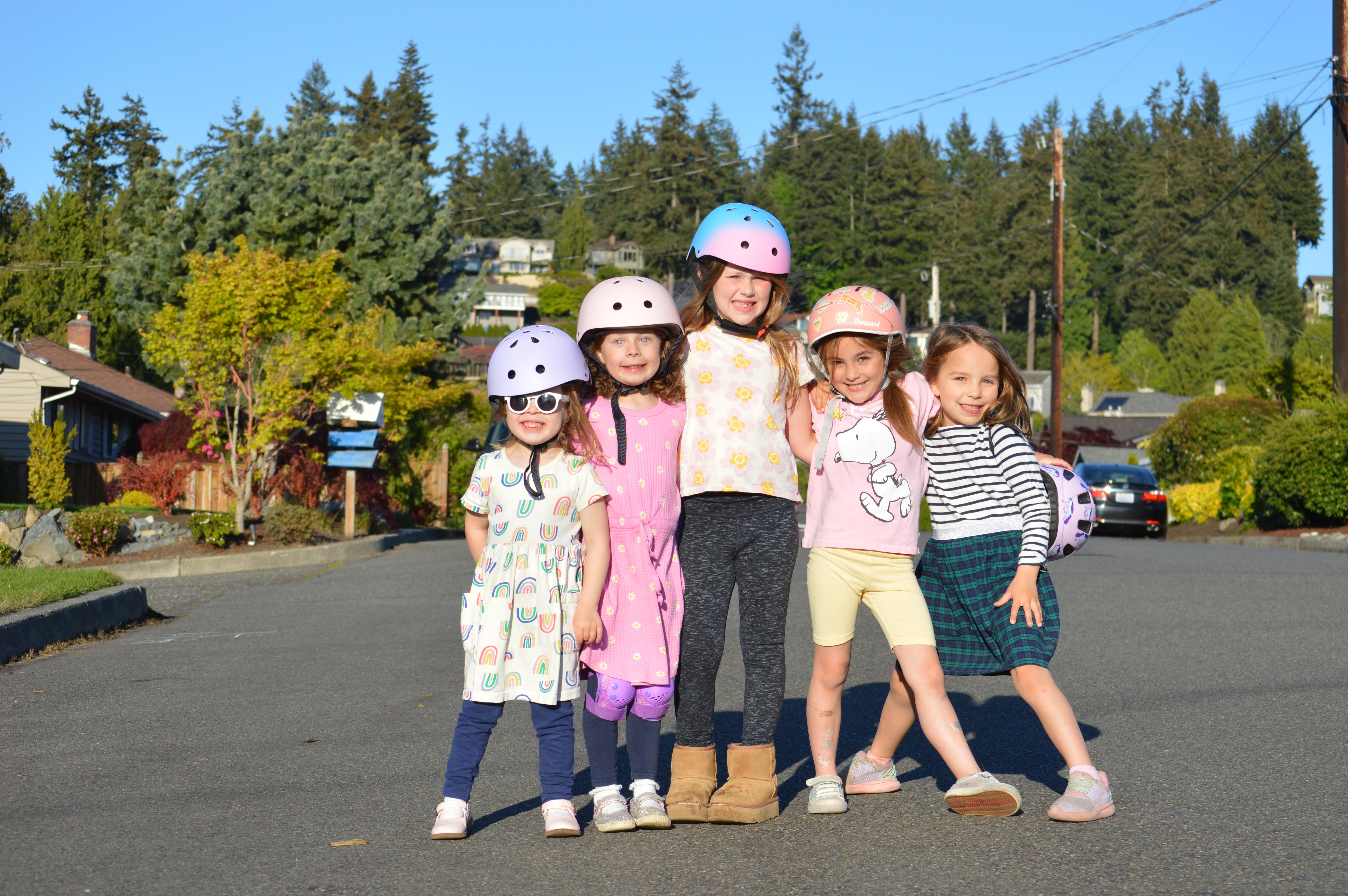 Girls wearing bike helmets